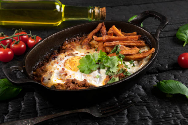istock Casserole with beef, onions, cheese and eggs close-up in a pan 1373003895