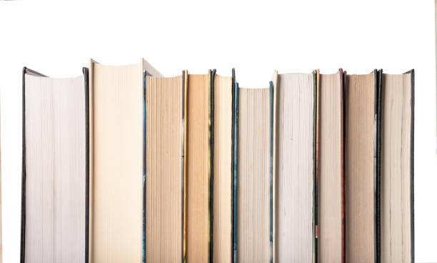 istock Hardcover books row isolated on white background. Reader lifestyle, study and getting knowledge in school, college or university concept 1373004272