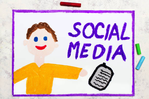 Small girl looks happy and raise hands in the library with a thumb up symbol on the laptop