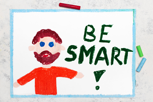 Colorful drawing: Smiling teacher with beard and word BE SMART next to him