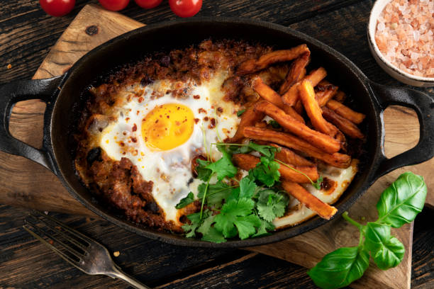 istock Casserole with beef, onions, cheese and eggs close-up in a pan 1373004351