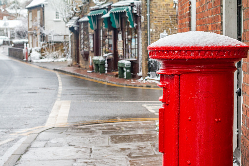 Public Mailbox at Eynsford High Street in Kent, England, after springtime snowfall.