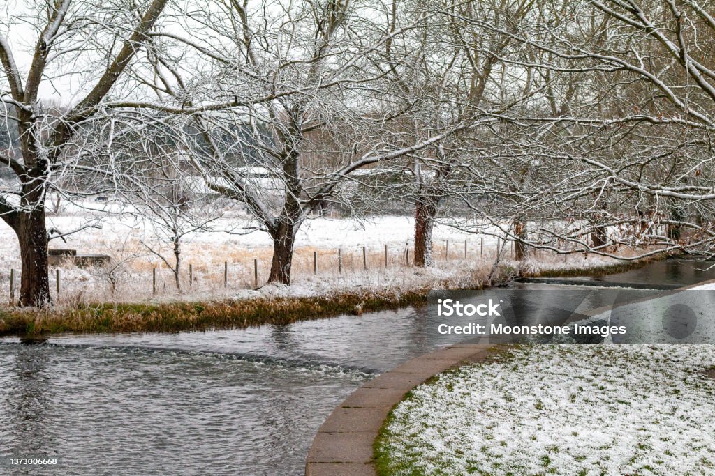 River Darent at Eynsford in Kent, England River Darent at Eynsford in Kent, England, after springtime snowfall. Frost Stock Photo