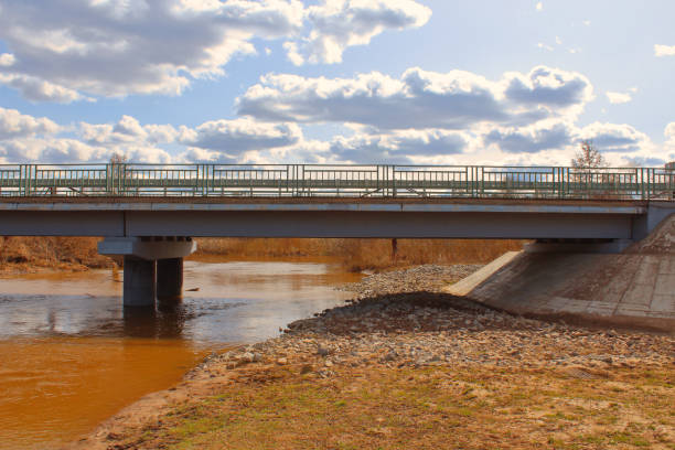 istock Reinforced concrete road bridge over the river. Close-up. Background. 1373006999