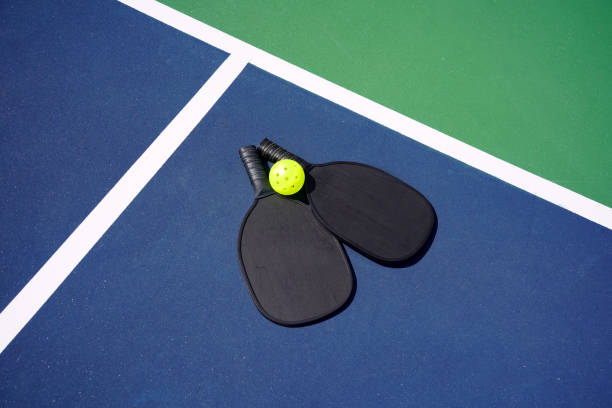 istock Pickle ball paddle on pickle ball court 1373008010