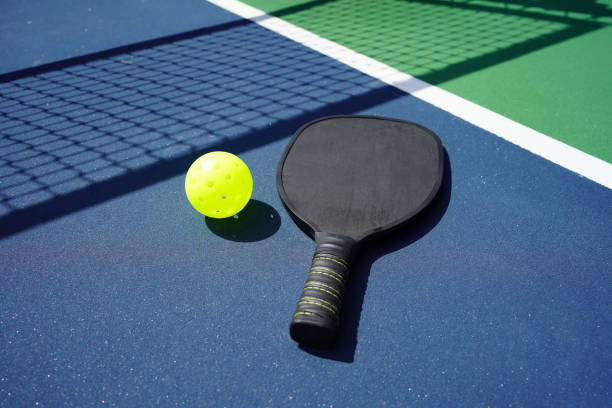 istock Pickle ball paddle on court 1373008179