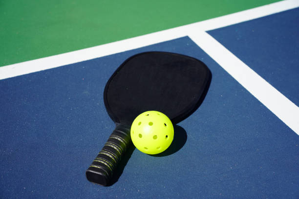 istock Pickleball paddle on court 1373009127