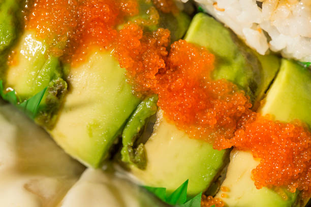 tobiko fish roe on top of dragon sushi roll