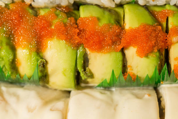 istock tobiko fish roe on top of dragon sushi roll 1373017456