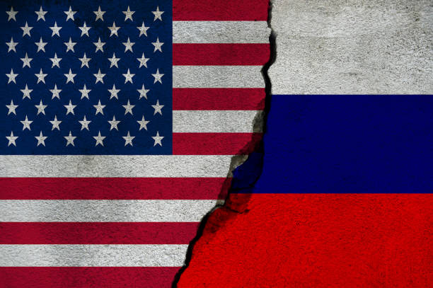 istock American and Russian flag on cracked wall 1373017866