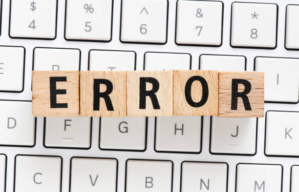 istock ERROR word made of wooden letters on the keyboard. 1373021084