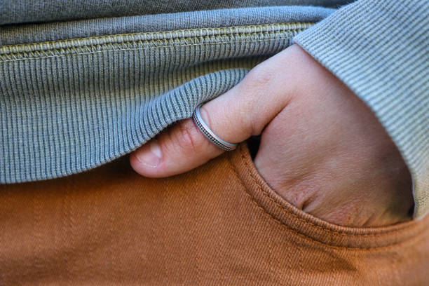 istock Hand In Pocket And Silver Ring On The Thumb 1373021125