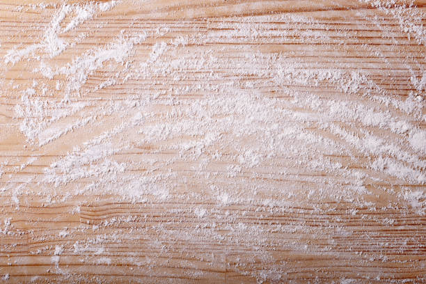 background with flour and pastry board, top view, space for text. - 砧板 個照片及圖片檔