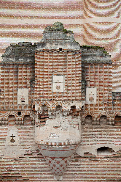 Castillo de Coca, located in Coca, Spain, Europe.  15th century architecture.   One of Castilla y Leon's most memorable fortresses.  Built of thin, pink or rose tinted bricks, it is an example of Mudejar military architecture.  Check out my: