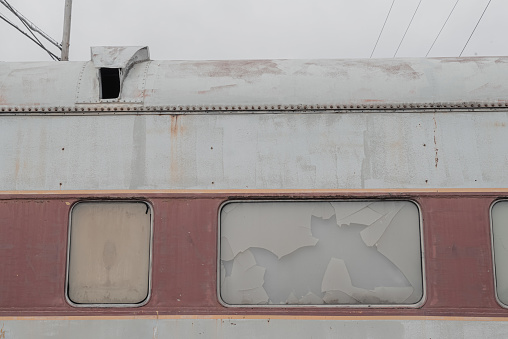 Lockport, New York, United States - December 22, 2021:  Abandoned weathered passenger rail carriage at a railway siding