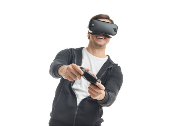 istock Cheerful man playing VR videogame 1373029067