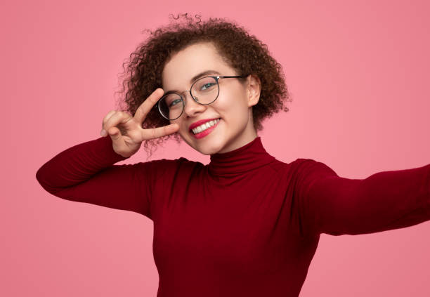 istock Happy woman taking self shot in studio 1373029130
