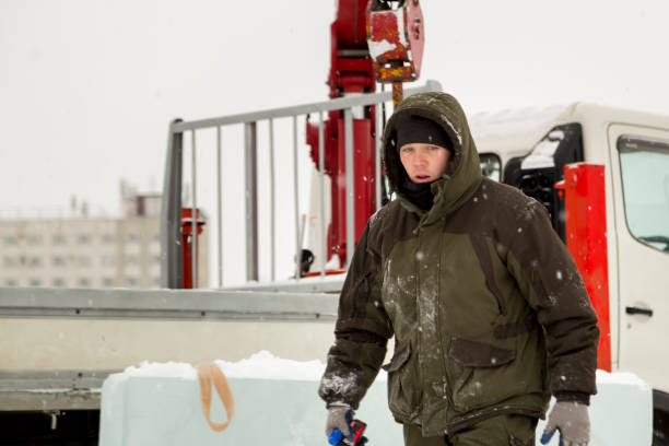 istock Worker at the assembly site at the truck crane 1373038944