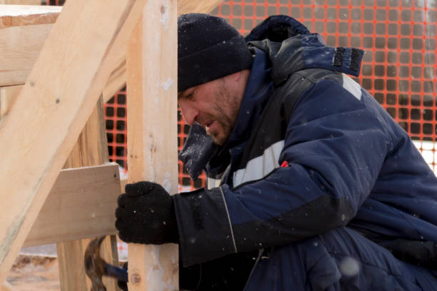 istock Worker assembling the frame of a wooden slide 1373039786