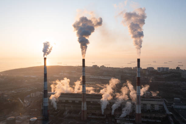 istock A factory with chimneys that emit smoke. 1373042112