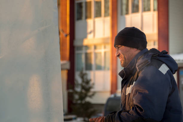 istock Worker on the installation of an ice panel 1373042864