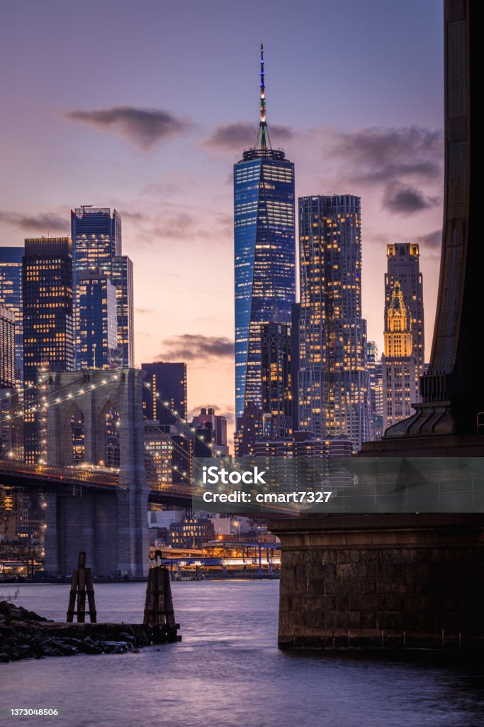 The Brooklyn Bridge, Freedom Tower and Lower Manhattan Lower Manhattan and the Brooklyn Bridge, shot from Brooklyn Bridge Park, Brooklyn, NY. USA New York City Stock Photo
