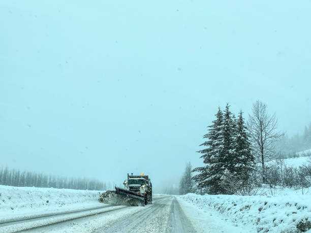 istock Snow Plow Clearing Roads on Snowy Day 1373053697