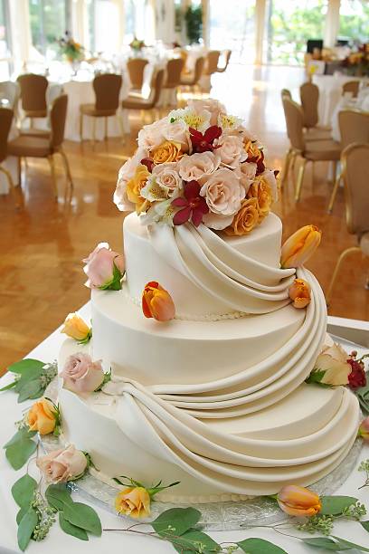 istock Beautiful white wedding cake with roses. 137305657