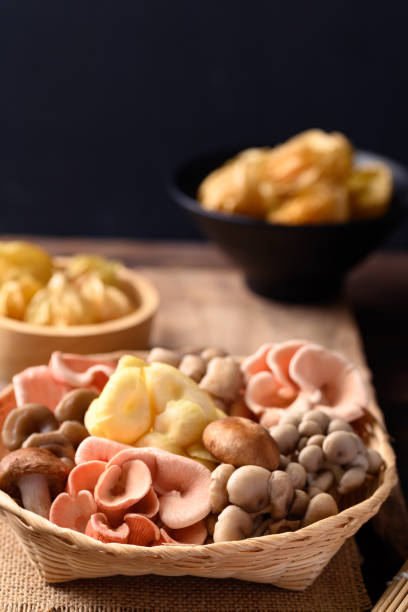 istock Mixed fresh mushroom (Edible mushroom) in bamboo basket, Food ingredients 1373058099