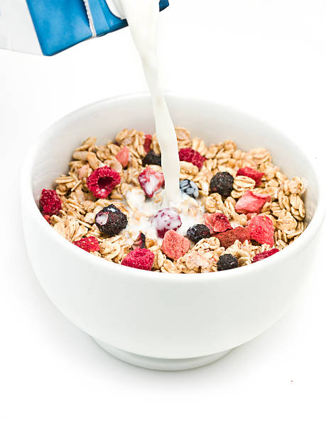istock pouring milk over morning granola and berries cereal 137306149