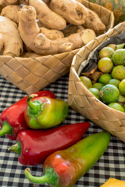 ginger, bell peppers and calamansi on display at a small market stall. - for sale industry farmers market market stall imagens e fotografias de stock