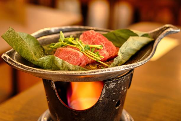 Gifu, Japan - February 24, 2022: Grilling hida beef with Hoba miso