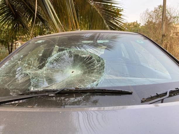 istock Shattered cracked broken damaged crashed car windshield at the right passenger side after a car accident. Dangerous, careless, unsafe, drunk, impaired driving, DUI, car crash injury fatality concept. 1373065665