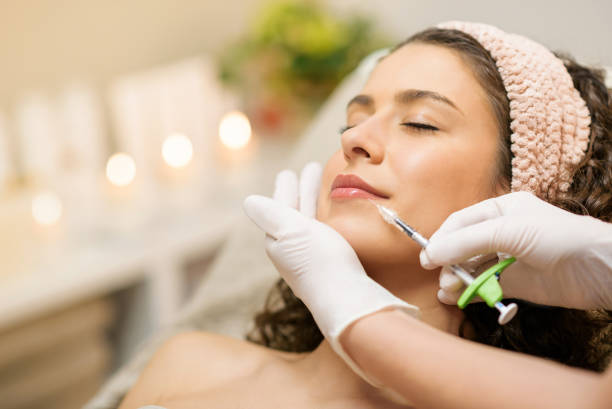Woman Getting Beauty Injection For Lips stock photo