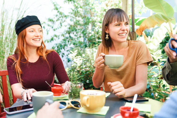 istock Cheerful friends having break in cafe 1373069388