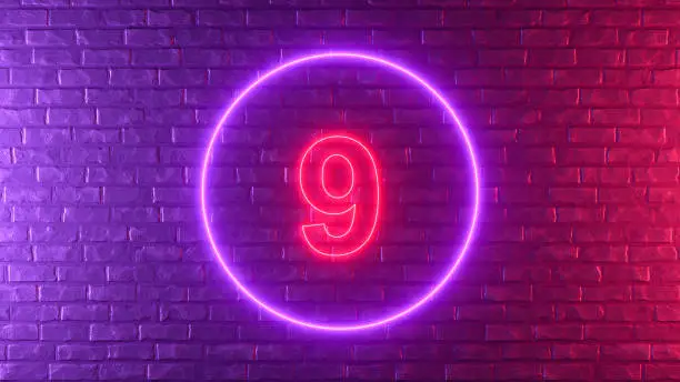 Photo of Number 9 with glowing neon lighting on black brick wall