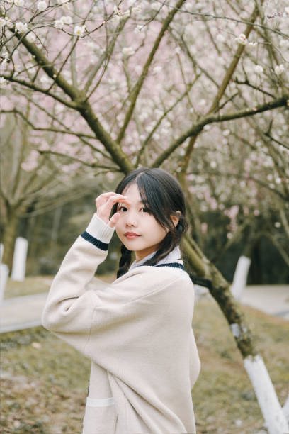 Beautiful asian girls under cherry trees
