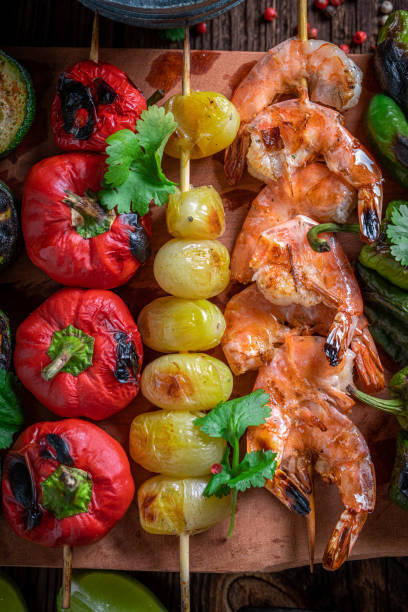 istock Hot roasted skewer with vegetables and seafood. 1373081850