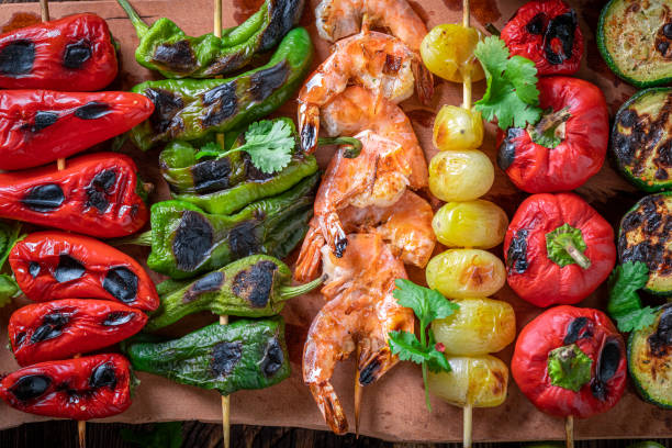 istock Hot roasted skewer on wooden board with spices. 1373082532