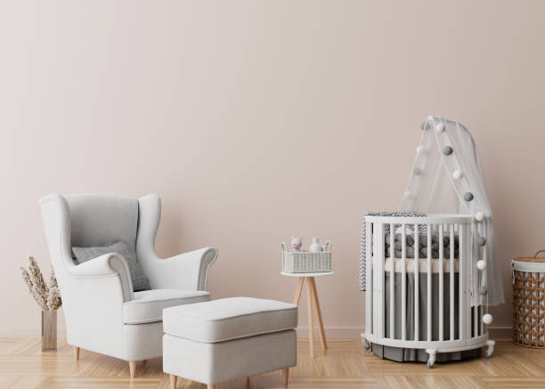 istock Empty cream wall in modern child room. Mock up interior in scandinavian style. Free, copy space for your picture, poster. Baby bed, armchair, pampas grass in vase. Cozy room for kids. 3D rendering. 1373084729