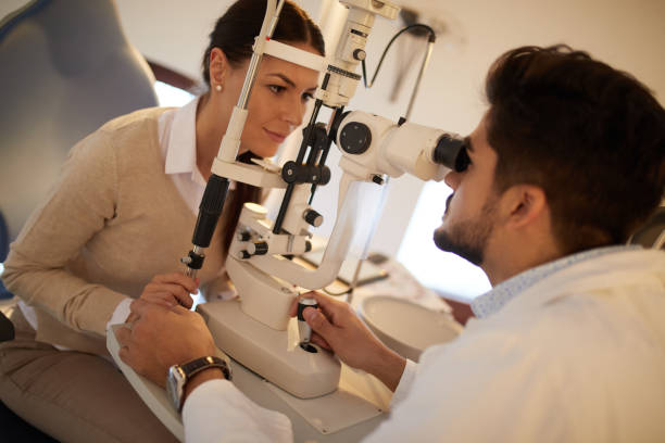 istock Young woman having her eyes examined by optometrist 1373085120