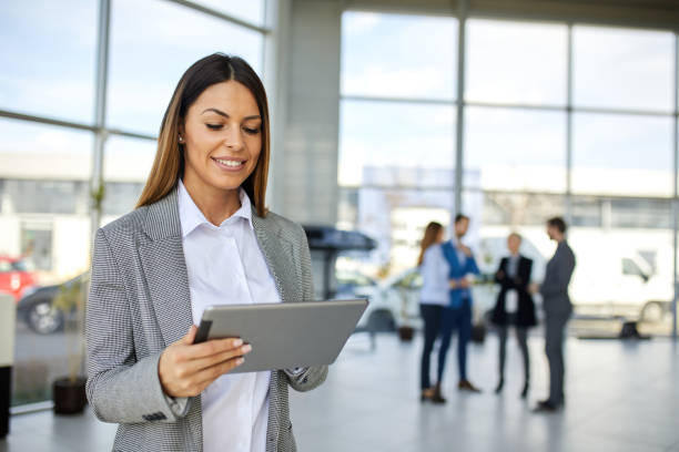 istock Young businesswoman using digital tablet looking for online data 1373086011