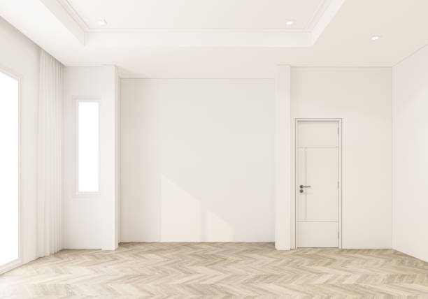 istock Empty room in white tone that has not been decorated. There are doors and large windows. on parquet floor 3d rendering 1373086122