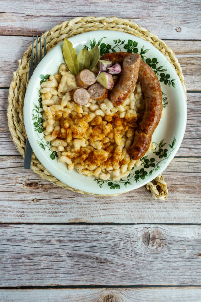 istock butifarra with beans, Botifarra amb mongetes or Botifarra amb seques, is a traditional dish of Catalan cuisine, based on butifarra and white beans. 1373086949