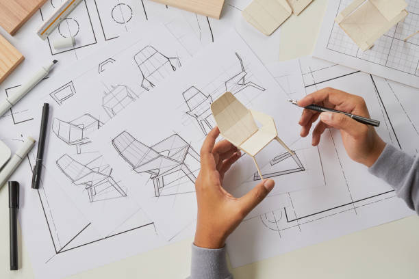 Designer sketching drawing design development product plan draft chair armchair Wingback Interior furniture prototype manufacturing production. designer studio concept . stock photo
