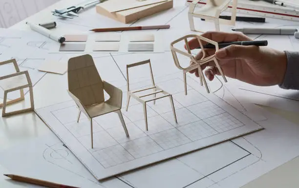 Photo of Designer sketching drawing design development product plan draft chair armchair Wingback Interior furniture prototype manufacturing production. designer studio concept .