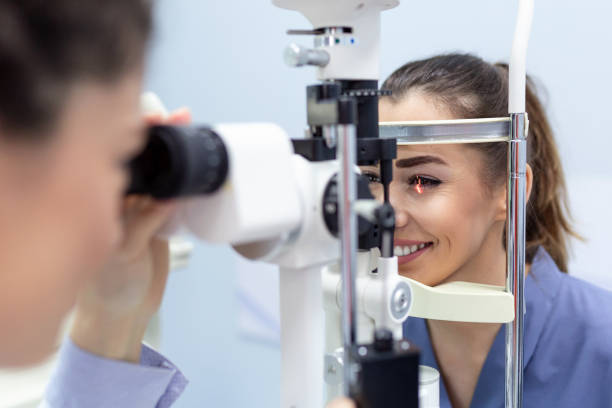 Female doctor ophthalmologist is checking the eye vision of attractive young woman in modern clinic. Doctor and patient in ophthalmology clinic. Female doctor ophthalmologist is checking the eye vision of attractive young woman in modern clinic. Doctor and patient in ophthalmology clinic eye exam stock pictures, royalty-free photos & images