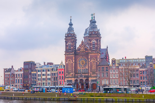 Amsterdam, Netherlands - March 31, 2016: Basilica church of St. Nicholas and street view