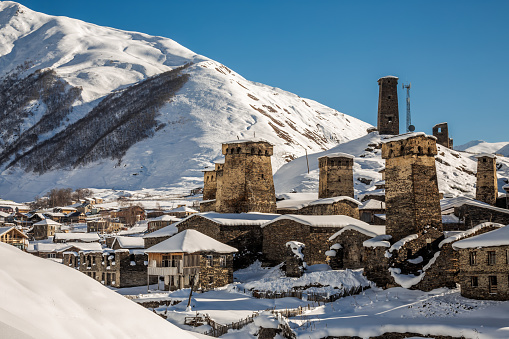Panoramic view on Medieval towers covered with snow in Mestia in the Caucasus Mountains, Upper Svaneti, Georgia.
