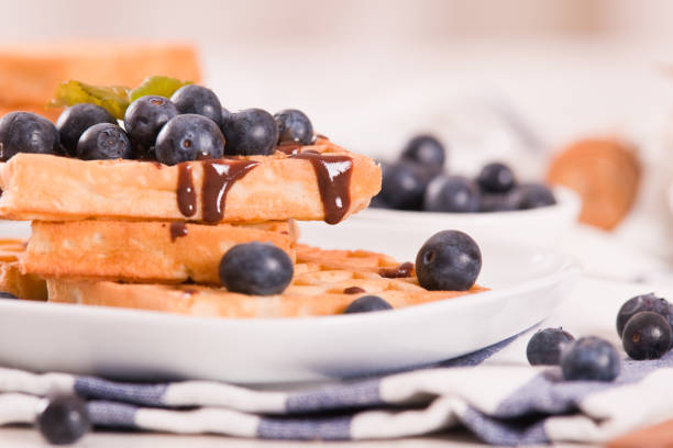 Waffles with blueberries and chocolate cream.